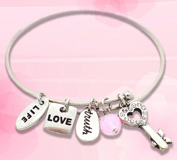 Open the door to eternal love with heart key charm bracelet